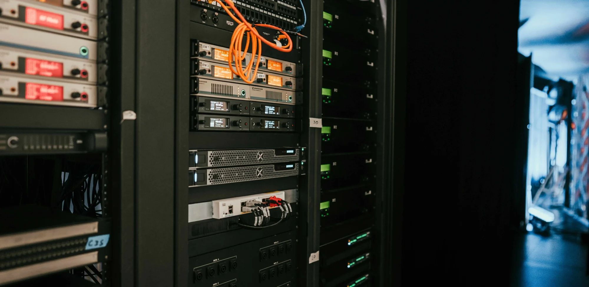 VPS provider data center rack with servers and network cables